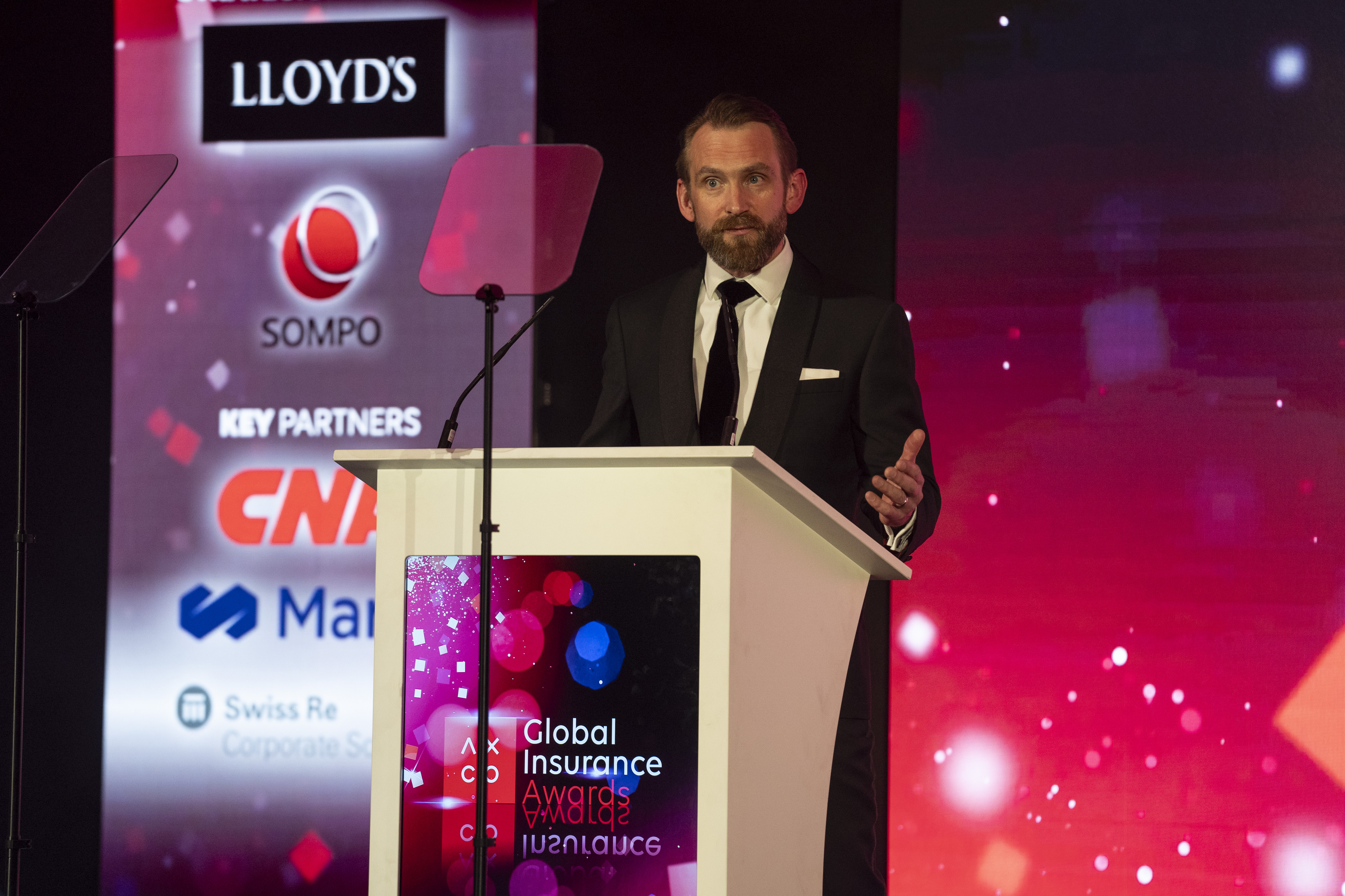 Man speaking at a lectern