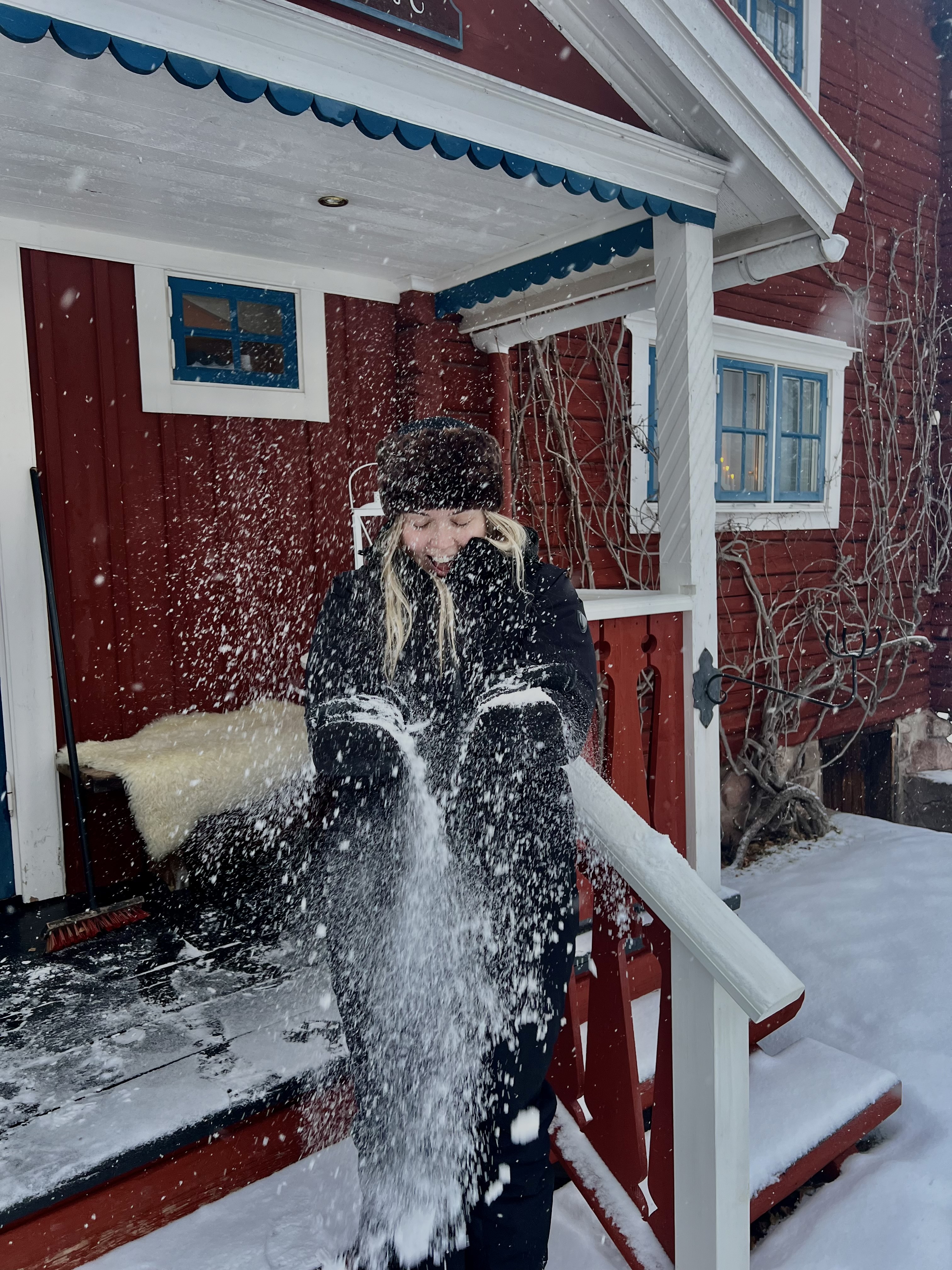 Woman on a porch in the snow