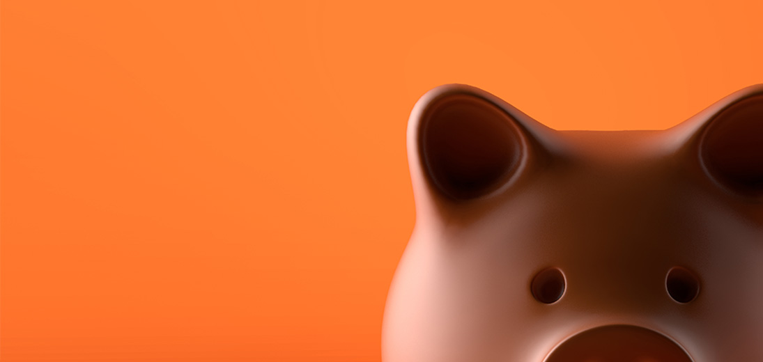 Piggy bank against an orange background